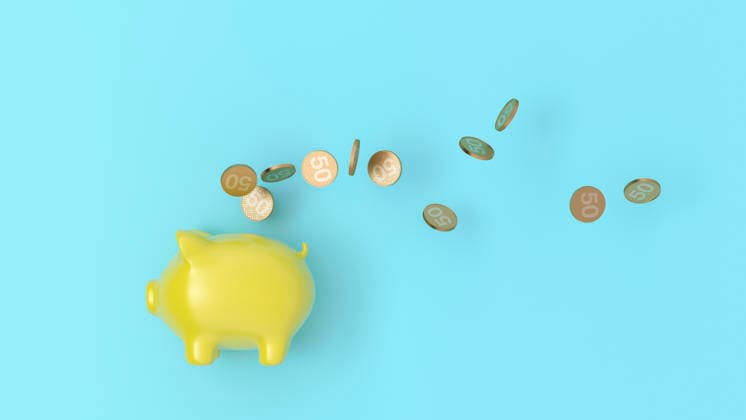 Yellow piggy bank and coins in 3D rendering on blue background, UWF02429