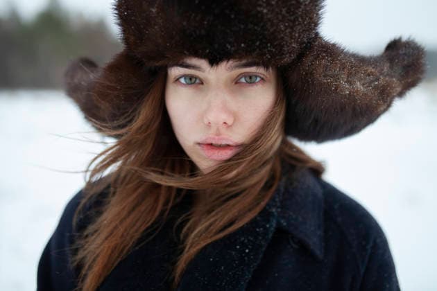 Winter portrait of woman with fur ushanka hat and long hair outdoors model released, Symbolfoto, VCF01169