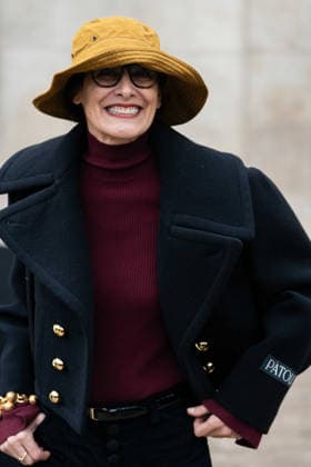 Patou - Outside Arrivals - Paris Fashion Week - Menswear Fall Winter 2026-2027 Ines de la Fressange wears red turtleneck sweater, black pants, black cropped coat, yellow bucket hat, outside Patou Menswear Fall Winter 2026-2027 show as part of Paris Fashion Week on January 25, 2026 in Paris, France., Credit:Lounis Tiar Avalon France, Paris  Copyright: xLounisxTiarx xAvalonx 1069344312