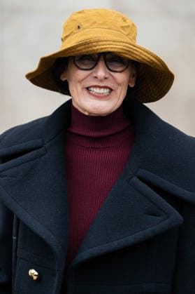 Patou - Outside Arrivals - Paris Fashion Week - Menswear Fall Winter 2026-2027 Ines de la Fressange wears red turtleneck sweater, black pants, black cropped coat, yellow bucket hat, outside Patou Menswear Fall Winter 2026-2027 show as part of Paris Fashion Week on January 25, 2026 in Paris, France., Credit:Lounis Tiar Avalon France, Paris  Copyright: xLounisxTiarx xAvalonx 1069346485