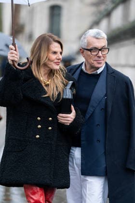 Patou - Outside Arrivals - Paris Fashion Week - Menswear Fall Winter 2026-2027 Anna Dello Russo (L) wears black Patou fur short coat, red over the knees leather boots, black bag, gold chain necklace, and Giorgio Guidotti (R) wears, white shirt, navy sweater, blue blazer, white pants, black coat, brown boots (R), outside Patou Menswear Fall Winter 2026-2027 show as part of Paris Fashion Week on January 25, 2026 in Paris, France., Credit:Lounis Tiar Avalon France, Paris  Copyright: xLounisxTiarx xAvalonx 1069346898