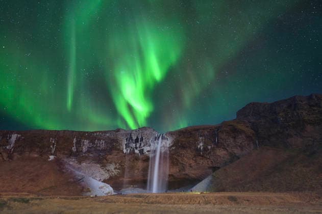 Northern lights at Seljalandsfoss Waterfall in Iceland Patreksfjörður, Vesturbyggð, Iceland CR_SSBW260125-1949766-01