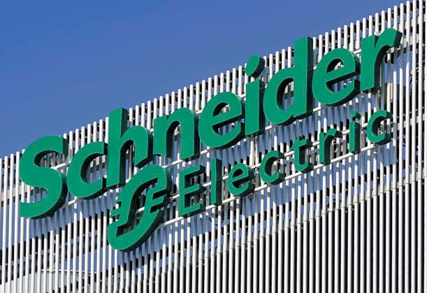 Schneider Electric - Bucharest, Romania Bucharest, Romania - August 16, 2021: A logo of Schneider Electric global specialist in energy management and automation company, is displayed on the top of a building, in Pipera neighborhood. Bucharest Romania Copyright: xLucianxAlecux DSC08650_210816