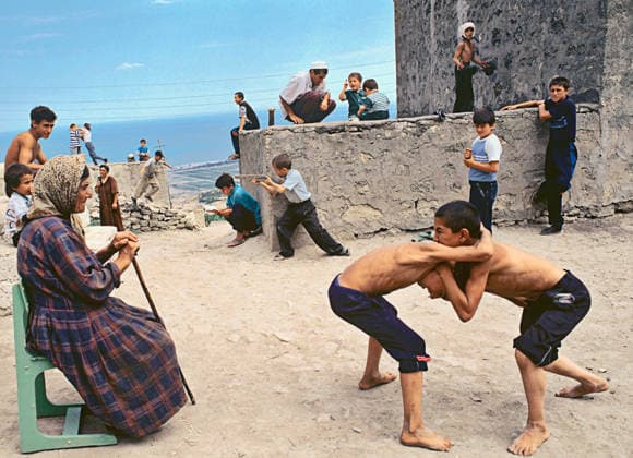 DERBENT ST. GEORGE SQUARE BOYS 166931 11.05.1996 Local boys like to play on a square near the grave of St. George in ancient Dagestani city Derbent. St. George, a famed warrior, is the only saint worshipped by Christians and Muslims alike. Vladimir Vyatkin, who shot this photo, received the Gold Medal at Interphoto-98 exhibition. Vladimir Vyatkin Sputnik Derbent Republic of Dagestan Russia  Copyright: xVladimirxVyatkinx
