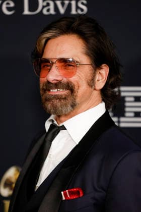 John Stamos arrives on the red carpet for the Pre-Grammy Gala on the eve of the 68th Annual Grammy Awards in Los Angeles on Saturday, January 31, 2026.  LAP20260131986 CAROLINExBREHMAN