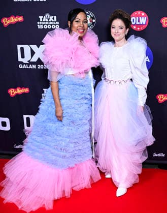 STOCKHOLM, SWEDEN 20260202 EU parliamentarian Alice Bah Kuhnke MP and speaker Amanda Lind MP arrive at the QX gala at Cirkus in Stockholm wearing two newly designed garments from remake designer Stina Löving in the colors of the trans flag STOCKHOLM SWEDEN x10030x  Copyright: xJonasxEkströmer TTx QX-GALAN 2026 9GU8WeHQmo4