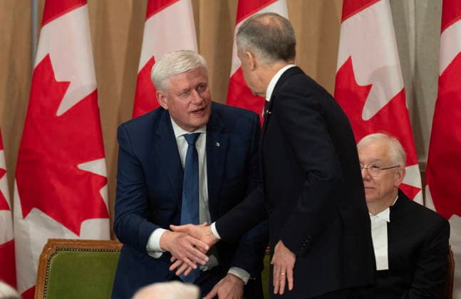 February 3, 2026, Ottawa, On, Canada: Prime Minister Mark Carney shakes hands with former prime minister Stephen Harper after speaking during a ceremony for Harper s official portrait unveiling in Ottawa, on Tuesday, Feb. 3, 2026. Ottawa Canada  - ZUMAc35_ 20260203_zaf_c35_089 Copyright: xAdrianxWyldx