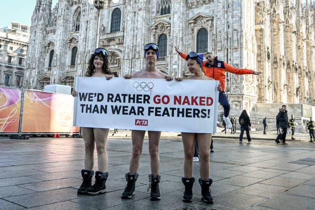 February 5, 2026, Milan, Mi, Italy: February 5, 2026, Milan. Piazza Duomo. Better Naked Than Wear Feathers, PETA s protest before the Olympics. A trio of nearly naked PETA supportersÃ¢â‚¬wearing only hats, ski goggles, and snow bootsÃ¢â‚¬stand behind a banner reading We d Rather Go Naked Than Wear Feathers! Milan Italy  - ZUMAa289 20260205_zia_a289_204 Copyright: xNicolaxMarfisix