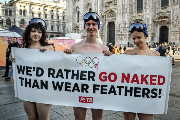 PETA protests We d Rather go naked than wear feathers! before the Olympics. February 5, 2026, Milan. Piazza Duomo. Better Naked Than Wear Feathers, PETA s protest before the Olympics. A trio of nearly naked PETA supporters wearing only hats, ski goggles, and snow boots stand behind a banner reading We d Rather Go Naked Than Wear Feathers! , Credit:Nicola Marfisi Avalon Italy, MI, Milan  Copyright: xNicolaxMarfisix xAvalonx 1072326557