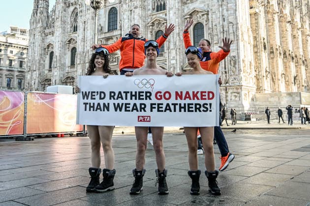 PETA protests We d Rather go naked than wear feathers! before the Olympics. February 5, 2026, Milan. Piazza Duomo. Better Naked Than Wear Feathers, PETA s protest before the Olympics. A trio of nearly naked PETA supporters wearing only hats, ski goggles, and snow boots stand behind a banner reading We d Rather Go Naked Than Wear Feathers! , Credit:Nicola Marfisi Avalon Italy, MI, Milan  Copyright: xNicolaxMarfisix xAvalonx 1072326595