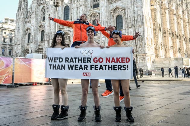 PETA protests We d Rather go naked than wear feathers! before the Olympics. February 5, 2026, Milan. Piazza Duomo. Better Naked Than Wear Feathers, PETA s protest before the Olympics. A trio of nearly naked PETA supporters wearing only hats, ski goggles, and snow boots stand behind a banner reading We d Rather Go Naked Than Wear Feathers! , Credit:Nicola Marfisi Avalon Italy, MI, Milan  Copyright: xNicolaxMarfisix xAvalonx 1072326615