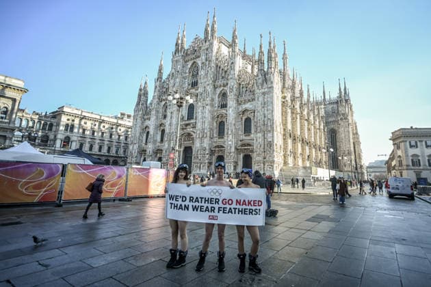 PETA protests We d Rather go naked than wear feathers! before the Olympics. February 5, 2026, Milan. Piazza Duomo. Better Naked Than Wear Feathers, PETA s protest before the Olympics. A trio of nearly naked PETA supporters wearing only hats, ski goggles, and snow boots stand behind a banner reading We d Rather Go Naked Than Wear Feathers! , Credit:Nicola Marfisi Avalon Italy, MI, Milan  Copyright: xNicolaxMarfisix xAvalonx 1072326644