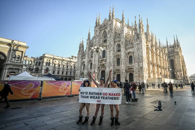 PETA protests We d Rather go naked than wear feathers! before the Olympics. February 5, 2026, Milan. Piazza Duomo. Better Naked Than Wear Feathers, PETA s protest before the Olympics. A trio of nearly naked PETA supporters wearing only hats, ski goggles, and snow boots stand behind a banner reading We d Rather Go Naked Than Wear Feathers! , Credit:Nicola Marfisi Avalon Italy, MI, Milan  Copyright: xNicolaxMarfisix xAvalonx 1072326649