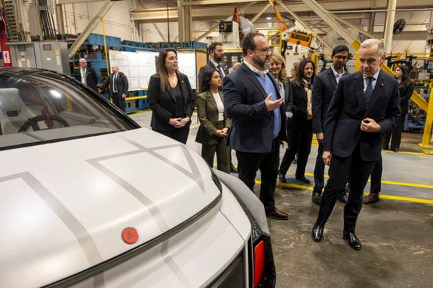 February 5, 2026, Woodbridge, Ontario, CANADA: Automotive Parts ManufacturersöÄÃ Association President Flavio Volpe shows Prime Minister Mark Carney, front right, the Project Arrow 2.0 prototype vehicle during a tour of an auto-parts plant, Woodbridge, Ont., February 5, 2026. Woodbridge CANADA - ZUMAc35_ 20260205_zaf_c35_058 Copyright: xEduardoxLimax