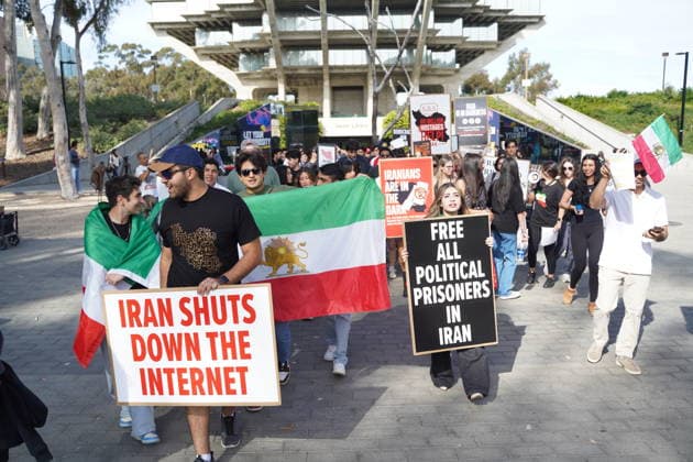 Iran Protest at UC San Diego - 5 Feb 2026 Students hold flags and placards during their march at UC San Diego campus on February 5, 2026, in San Diego, California. About 100 students protest on the UC San Diego campus on Feb. 5, 2026, marching through campus in the afternoon to show support for people in Iran amid ongoing unrest. Demonstrators say the current situation in Iran has affected thousands of people and resulted in many deaths and injuries during protests there. Students carry signs and chant as they move around campus, calling attention to the uprising in Iran and expressing solidarity with those impacted. San Diego United States Copyright: xMichaelxHoxWaixLeex xSOPAxImagesx MichaelHo_5631