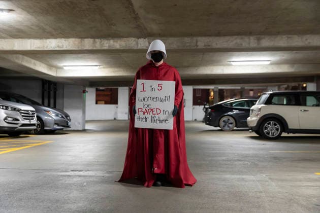 February 5, 2026, Seattle, Washington, USA: An activist poses for a photo before a silent march through SeattleÃ¢â‚¬â ¢s Pioneer Square dressed as a woman from The Handmaid s TaleÃ¢â‚¬Â during First Thursday Art Walk on February 5, 2026. The protest was organized by Defund MuskÃ¢â‚¬â ¢s WomenÃ¢â‚¬â ¢s Group against the Trump administrationÃ¢â‚¬â ¢s policies towards womenÃ¢â‚¬â ¢s rights and the perceived corrupt influence of billionaires in politics. Seattle USA - ZUMAg235 20260205_zap_g235_008 Copyright: xPaulxChristianxGordonx
