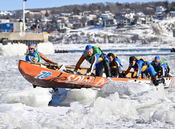February 8, 2026, Quebec, Pq, Canada: The men and women of the Chateau Frontenac Le Soleil ice canoe mixed team pulls their canoe from the water and onto the ice as they race to the finish at the Quebec winter carnival in Quebec City Sunday, Feb. 8, 2026. Quebec Canada  - ZUMAc35_ 20260208_zaf_c35_209 Copyright: xJacquesxBoissinotx
