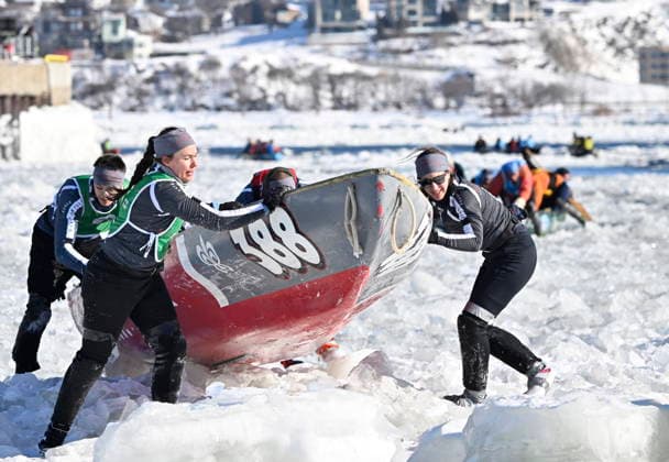 February 8, 2026, Quebec, Pq, Canada: The women of the Auberge Saint-Antoine ice canoe team pull their canoe from the water and onto the ice as they race to the finish at the Quebec winter carnival in Quebec City Sunday, Feb. 8, 2026. Quebec Canada  - ZUMAc35_ 20260208_zaf_c35_210 Copyright: xJacquesxBoissinotx