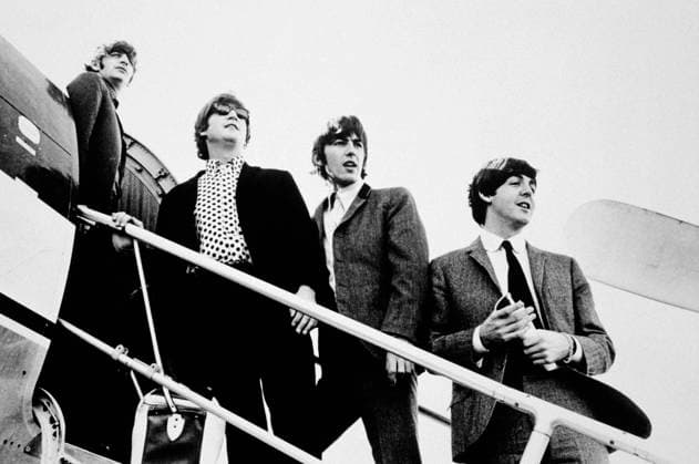RECORD DATE NOT STATED The Beatles (Ringo Starr, John Lennon, George Harrison, and Paul McCartney) boarding a plane circa 1965 EDITORIAL USE ONLY  Copyright: xGuntherx