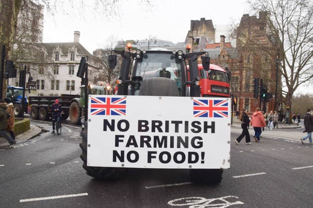 February 11, 2026, London, England, United Kingdom: Tractors drive around in Parliament Square as farmers stage a protest against inheritance tax. London United Kingdom  - ZUMAv130 20260211_zip_v130_035 Copyright: xVukxValcicx