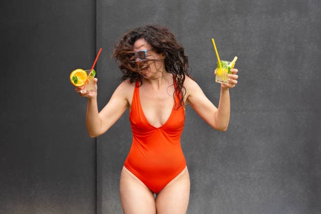 Happy woman in red swimsuit with cocktails on a vacation Truskavets, Lviv Oblast, Ukraine R_YEPI260206-1960329-01 ,model released, Symbolfoto