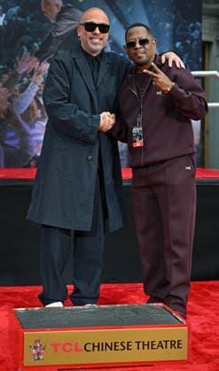 Jo Koy (L) and Martin Lawrence attend a hand and footprint ceremony honoring Koy in the forecourt of the TCL Chinese Theatre in Los Angeles, California on Wednesday, February 11, 2026.  LAP20260211713 CHRISxCHEW