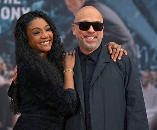 Tiffany Haddish (L) and Jo Koy attend a hand and footprint ceremony honoring Koy in the forecourt of the TCL Chinese Theatre in Los Angeles, California on Wednesday, February 11, 2026.  LAP20260211715 CHRISxCHEW