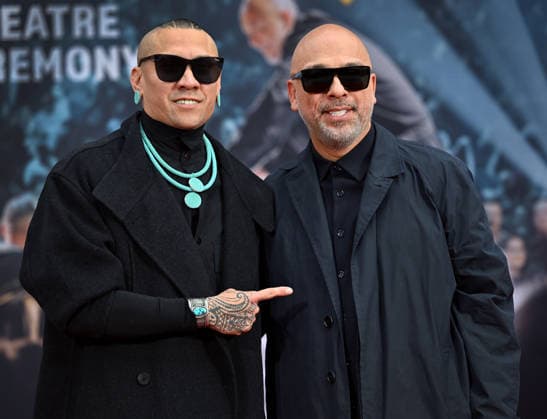 Rapper Taboo of the Black Eyed Peas (L) and Jo Key attend a hand and footprint ceremony honoring Koy in the forecourt of the TCL Chinese Theatre in Los Angeles, California on Wednesday, February 11, 2026.  LAP20260211725 CHRISxCHEW