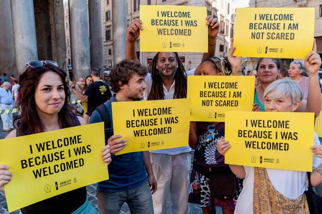 Amnesty International hold flashmob for World Refugee Day ROME, ITALY - JUNE 20: Activists of human rights organization Amnesty International hold in front of the Pantheon during a flashmob on World Refugee Day on June 20, 2017 in Rome, Italy. Amnesty International calls on the international community to take concrete action to support the protection of refugees, activate safe channels and mobility opportunities and create an alternative to dangerous irregular crossings. Rome Italy Copyright: xStefanoxMontesix
