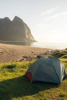 MR_ID32524_23616_IoritzLopez.jpg, MR_ID32524_23617_ArgineSatrustegui.jpg A serene camping scene in the Lofoten Islands, Northern Norway, capturing a tent by the beach under the summer midnight sun, perfect for trekking Model Released IoritzLopez_ID32524_1108263_045 Copyright: xIoritzxLopezx RECORD DATE NOT STATED