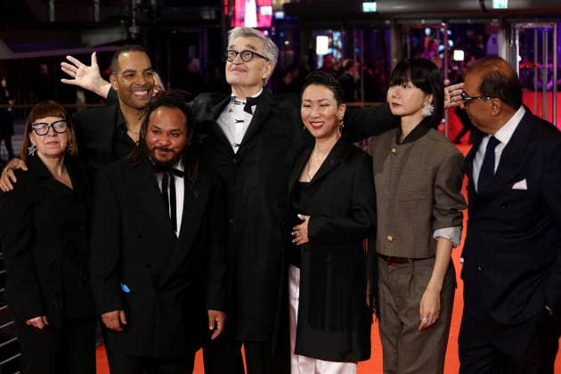 February 12, 2026, Berlin, Germany: International Jury members Shivendra Singh Dungarpur, Min Bahadur Bham, Jury President Wim Wenders, Bae Doona, Hikari, Ewa Puszczynska, and Reinaldo Marcus Green pose on the red carpet at the opening ceremony of the 76th Berlin International Film Festival (Berlinale), which is Europe s first major film festival of the year, in Berlin. The festival runs from February 12 to 22, 2026. Berlin Germany  - ZUMAf146 20260212_zip_f146_089 Copyright: xRouzbehxFouladix