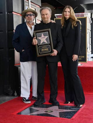 Italian actor Franco Nero (C) is joined by US painter and film director Julian Schnabel (L) and his partner Swedish screenwriter Louise Kugelbergduring during an unveiling ceremony honoring him with the 2,835th star on the Hollywood Walk of Fame in Los Angeles on Thursday, February 12, 2026.  LAP2026021206 JIMxRUYMEN