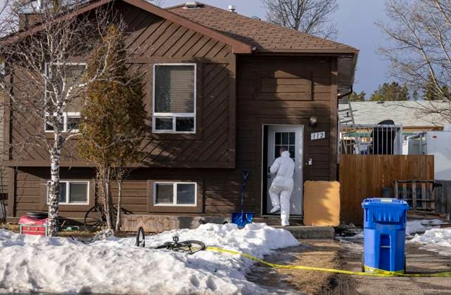 February 12, 2026, Tumbler Ridge, Bc, CANADA: A police investigator enters the home where two bodies were found in Tumbler Ridge, B.C., on Thursday, Feb. 12, 2026. Tumbler Ridge CANADA  - ZUMAc35_ 20260212_zaf_c35_332 Copyright: xChristinnexMuschix