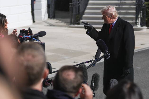 February 13, 2026, Washington, District Of Columbia, USA: U.S. PRESIDENT DONALD TRUMP speaks to members of the press prior to boarding Marine One at the White House in Washington, D.C. on February 13, 2026, en route to Fayetteville, North Carolina. Washington USA  - ZUMAd227 20260213_znp_d227_014 Copyright: xBryanxDozierx