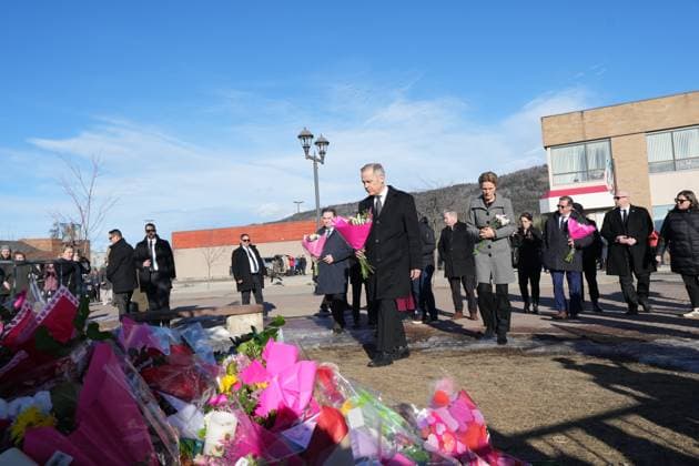 February 13, 2026, Tumbler Ridge, Bc, CANADA: Prime Minister Mark Carney and his wife Diana Fox Carney arrive to place flowers at a memorial for the victims of a mass shooting, in Tumbler Ridge, B.C., Friday, Feb. 13, 2026. Tumbler Ridge CANADA  - ZUMAc35_ 20260213_zaf_c35_093 Copyright: xChristinnexMuschix