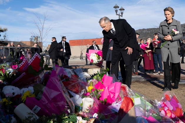 February 13, 2026, Tumbler Ridge, Bc, CANADA: Prime Minister Mark Carney and his wife Diana Fox Carney place flowers at a memorial for the victims of a mass shooting, in Tumbler Ridge, B.C., Friday, Feb. 13, 2026. Tumbler Ridge CANADA  - ZUMAc35_ 20260213_zaf_c35_140 Copyright: xChristinnexMuschix