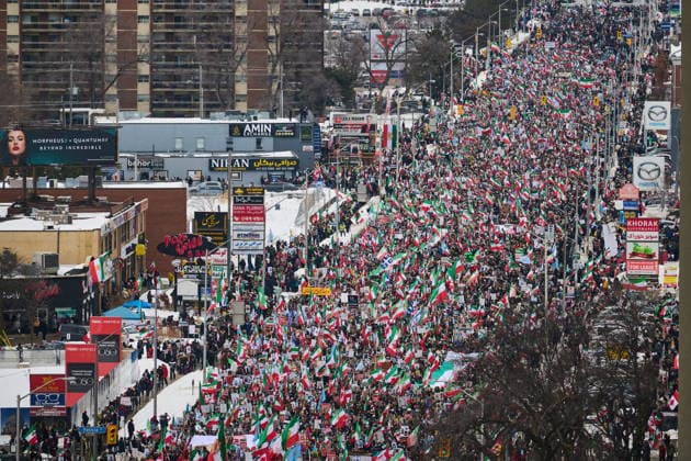 February 14, 2026, Toronto, On, Canada: Protesters march in support of regime change in Iran during a demonstration in Toronto, on Saturday, Feb. 14, 2026. Toronto Canada  - ZUMAc35_ 20260214_zaf_c35_105 Copyright: xSammyxKoganx