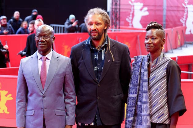February 14, 2026, Berlin, Germany: Alain Gomis (C) and guest attends the red carpet for the film Dao premiere during the 76th Berlin International Film Festival (Berlinale), which is Europe s first major film festival of the year, in Berlin. The festival runs from February 12 to 22, 2026. Berlin Germany  - ZUMAf146 20260214_zip_f146_122 Copyright: xRouzbehxFouladix