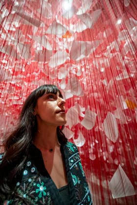 February 16, 2026, London, London, UK: LONDON, UK. A staff member with Ã¢â‚¬ËœLetters of ThanksÃ¢â‚¬â ¢, 2026, at a preview of Chiharu Shiota: Threads of Life, a new exhibition by Japanese performance and installation artist Chiharu Shiota at the Hayward Gallery presenting her iconic floor-to-ceiling weblike works made of red, white and black thread. The show runs 17 February to 3 May 2026. London UK  - ZUMAl94_ 20260216_zaf_l94_008 Copyright: xStephenxChungx