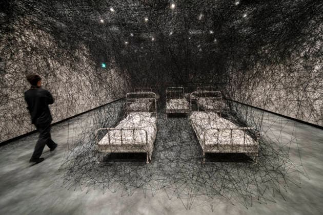 February 16, 2026, London, London, UK: LONDON, UK. A staff member with Ã¢â‚¬â ¢During SleepÃ¢â‚¬â ¢, 2026, at a preview of Chiharu Shiota: Threads of Life, a new exhibition by Japanese performance and installation artist Chiharu Shiota at the Hayward Gallery presenting her iconic floor-to-ceiling weblike works made of red, white and black thread. The show runs 17 February to 3 May 2026. London UK  - ZUMAl94_ 20260216_zaf_l94_012 Copyright: xStephenxChungx