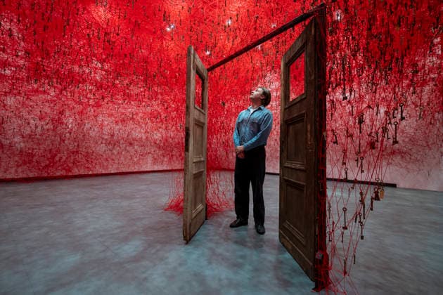 February 16, 2026, London, London, UK: LONDON, UK. A staff member with Ã¢â‚¬ËœThreads of LifeÃ¢â‚¬â ¢, 2026, at a preview of Chiharu Shiota: Threads of Life, a new exhibition by Japanese performance and installation artist Chiharu Shiota at the Hayward Gallery presenting her iconic floor-to-ceiling weblike works made of red, white and black thread. The show runs 17 February to 3 May 2026. London UK  - ZUMAl94_ 20260216_zaf_l94_017 Copyright: xStephenxChungx
