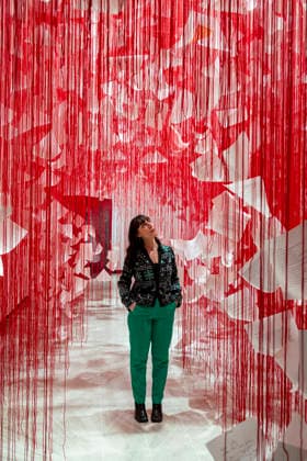 February 16, 2026, London, London, UK: LONDON, UK. A staff member with Ã¢â‚¬ËœLetters of ThanksÃ¢â‚¬â ¢, 2026, at a preview of Chiharu Shiota: Threads of Life, a new exhibition by Japanese performance and installation artist Chiharu Shiota at the Hayward Gallery presenting her iconic floor-to-ceiling weblike works made of red, white and black thread. The show runs 17 February to 3 May 2026. London UK  - ZUMAl94_ 20260216_zaf_l94_006 Copyright: xStephenxChungx