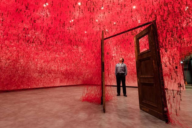 February 16, 2026, London, England, United Kingdom: A staff member looks at an art installation titled Threads of Life , 2026, by Chiharu Shiota during a photocall at the Hayward Gallery ahead of the first major solo London exhibition titled Threads of Life of the Berlin-based Japanese artist. London United Kingdom  - ZUMAs371 20260216_zip_s371_013 Copyright: xWiktorxSzymanowiczx
