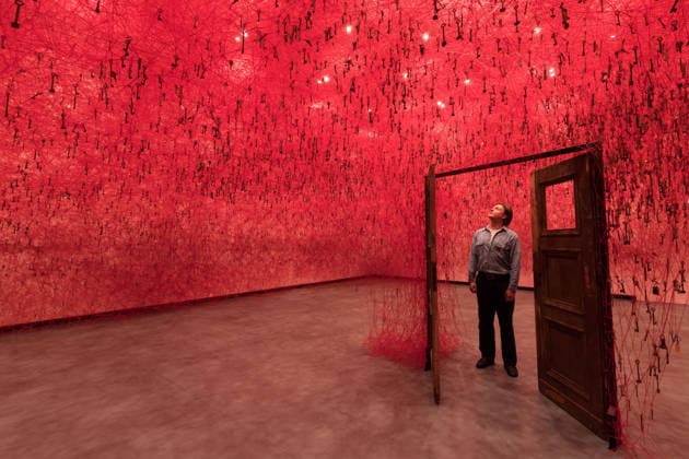 February 16, 2026, London, England, United Kingdom: A staff member looks at an art installation titled Threads of Life , 2026, by Chiharu Shiota during a photocall at the Hayward Gallery ahead of the first major solo London exhibition titled Threads of Life of the Berlin-based Japanese artist. London United Kingdom  - ZUMAs371 20260216_zip_s371_015 Copyright: xWiktorxSzymanowiczx