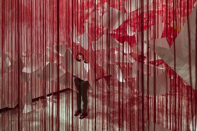 February 16, 2026, London, England, United Kingdom: A staff member looks at Letters of Thanks , 2026, by Chiharu Shiota during a photocall at the Hayward Gallery ahead of the first major solo London exhibition titled Threads of Life of the Berlin-based Japanese artist. London United Kingdom  - ZUMAs371 20260216_zip_s371_018 Copyright: xWiktorxSzymanowiczx