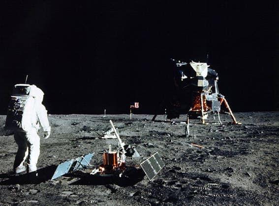 Apollo 11: Man s First Moon Walk June 15, 1965 - ..(Real lunar mission image) Buzz Aldrin assembles seismic experiment..Fascinating Images Show First Men On Moon Practicing On Fake Lunar Surface..These fascinating images might do little to dispel conspiracy theories that the 1969 moon landing was faked.....They feature Apollo 11 astronauts Neil Armstrong and Edwin ( Buzz ) Aldrin carrying out tasks on a clearly simulated lunar surface.....While the astronauts practice manoeuvres, including collecting soil samples, men in shirts and ties can be seen in the background casually observing the scene.....In fact, these are real training simulations carried out in Houston three months before the actually set foot on the moon.....The practice ses Copyright: xNASAx