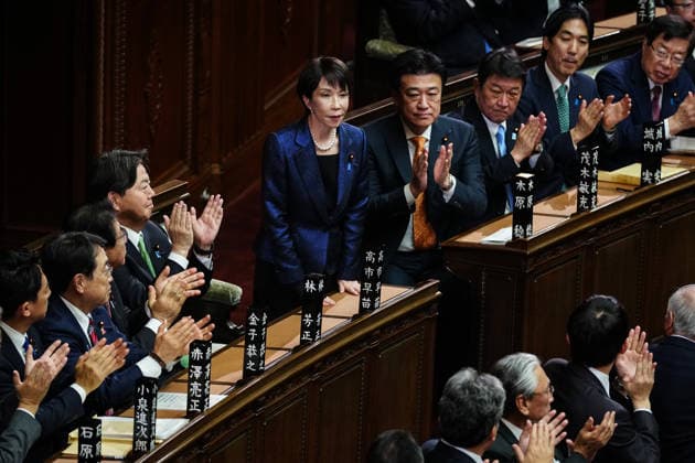 (260218) -- TOKYO, Feb. 18, 2026 -- Sanae Takaichi (C) stands after winning Japan s prime ministerial designation vote in the House of Representatives in Tokyo, Japan, Feb. 18, 2026. Sanae Takaichi, president of Japan s ruling Liberal Democratic Party, was elected as the country s 105th prime minister on Wednesday by lawmakers in parliament. ) JAPAN-TOKYO-SANAE TAKAICHI-REELECTION-PM JiaxHaocheng 