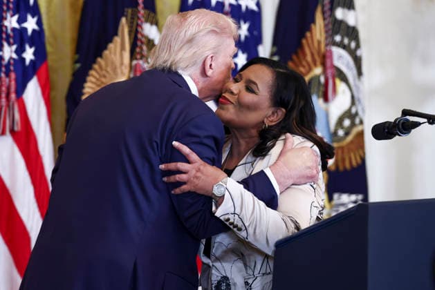 President Donald Trump embraces Alice Marie Johnson, the White House Pardon Czar, during a reception for Black History Month in the East Room of the White House in Washington, DC on Wednesday, February 18, 2026. The event comes less than two weeks after President Trump s Truth Social account shared a racist video of former President Barack Obama and former First Lady Michelle Obama.  WASP20260218104 JIMxLOxSCALZO