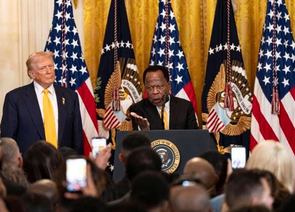 February 18, 2026, Washington, District Of Columbia, USA: Attorney Leo Terrell, right, makes remarks as United States President Donald J Trump, left, listens during a Black History Month Reception in the East Room of the White House in Washington, DC, USA, on Wednesday, February 18, 2026 Washington USA - ZUMAs152 20260218_faa_s152_024 Copyright: xAndrewxThomasx