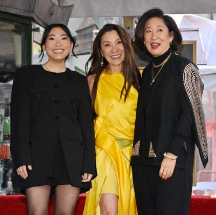 Actress Michelle Yeoh (C) is joined by actresses Awkwafina (L) and Sandra Oh during an unveiling ceremony honoring her with the 2,836th star on the Hollywood Walk of Fame in Los Angeles on Wednesday, February 18, 2026.  LAP2026021816 JIMxRUYMEN